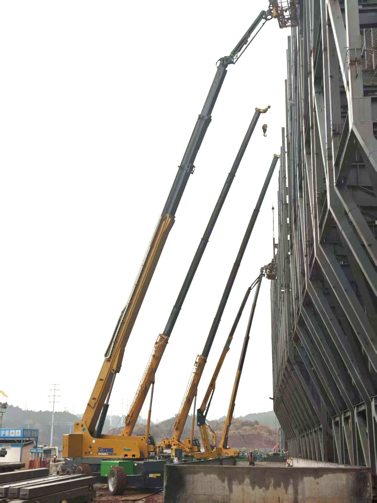 高空協(xié)同顯實力｜徐工裝備助陣銀聯(lián)黃山園區(qū)，外立面施工提質(zhì)增效